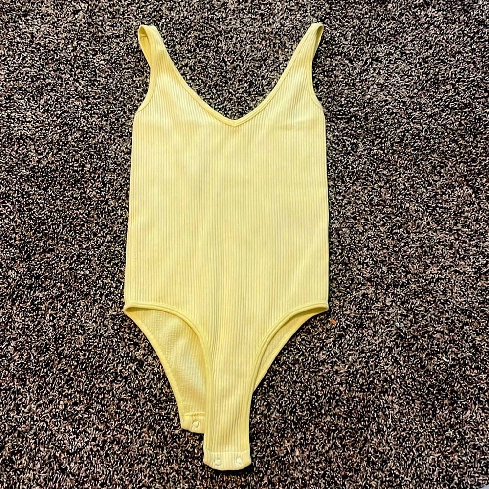Aura yellow body suit